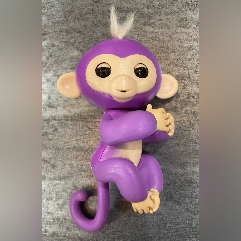 Wow Wee Fingerlings Baby Monkey Mia interactive toy in purple